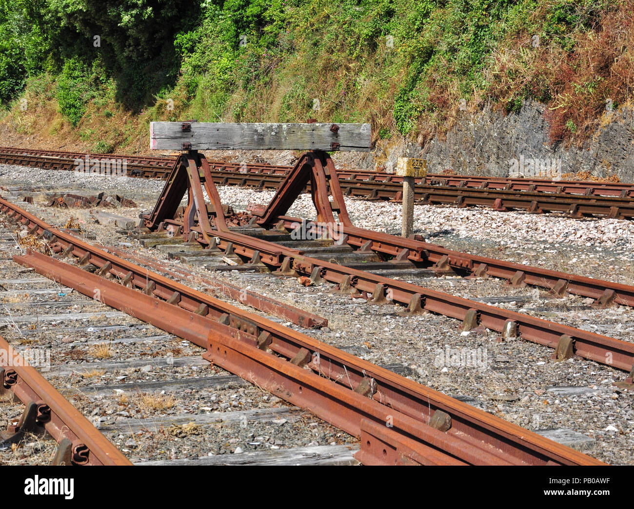 Buffer stop and rusty sidings, Dartmouth Steam Railway, Kingswear, South Devon, England, UK Stock Photo