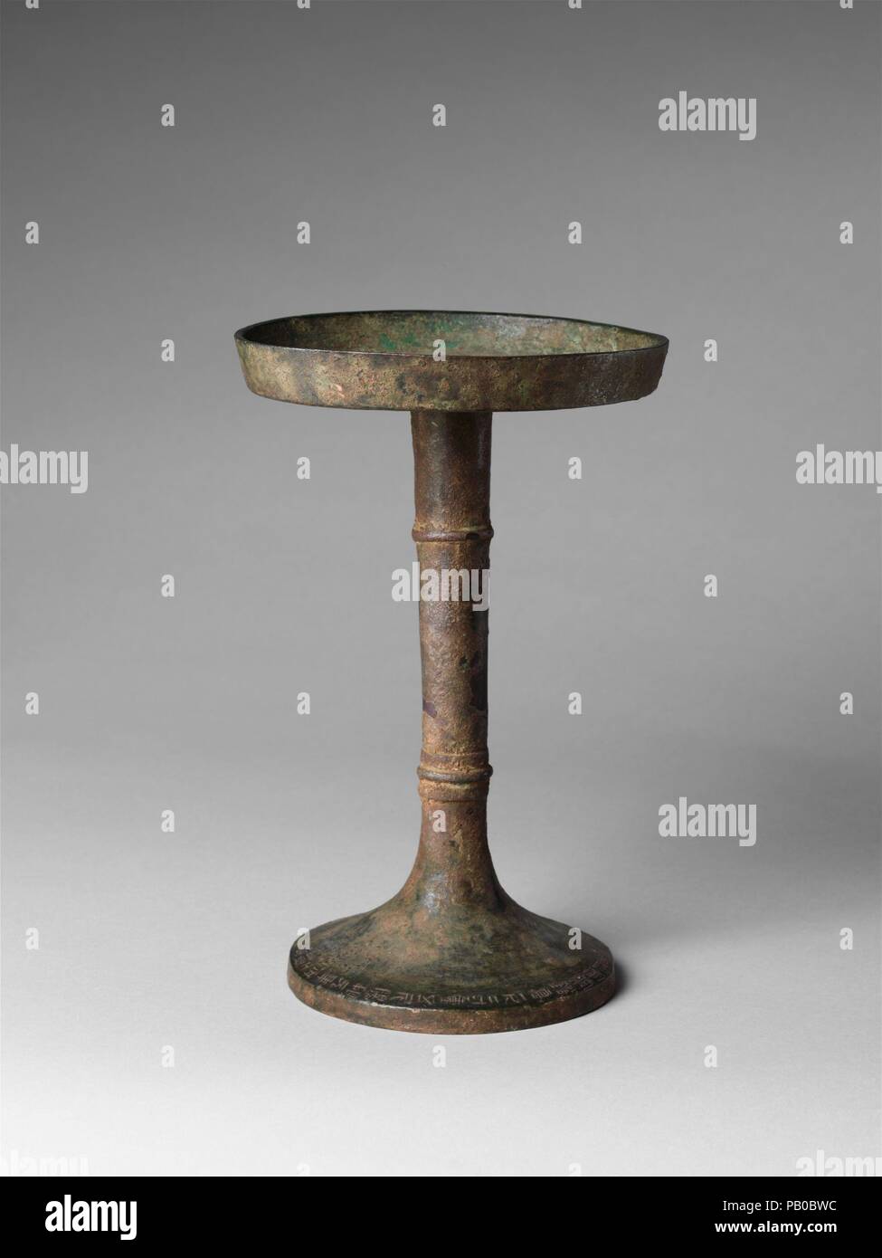Candlestick (Deng). Culture: China. Dimensions: H. 9 1/8 in. (23.2 cm); Diam. 5 3/4 in. (14.6 cm). Museum: Metropolitan Museum of Art, New York, USA. Stock Photo