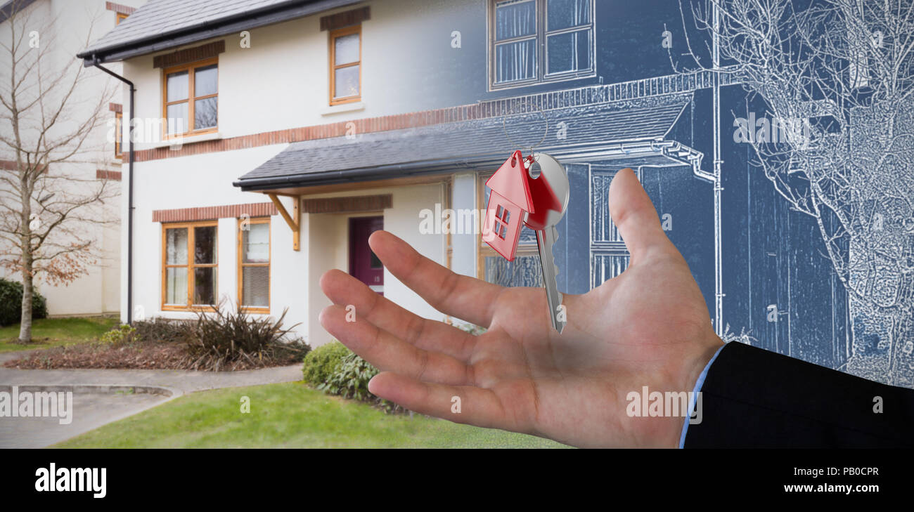 Composite image of copped hand on businessman holding invisible product Stock Photo
