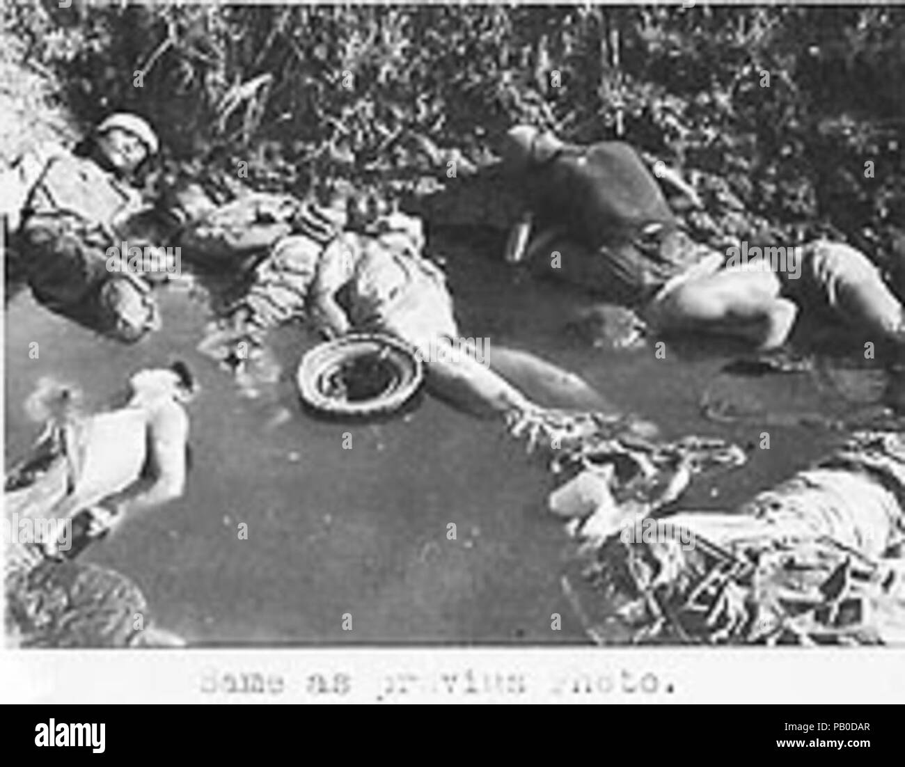 A waterpond filled with the bodies of executed Chinese soldiers who got safety promise by Japanese (b) Nanjing Massacre. Stock Photo