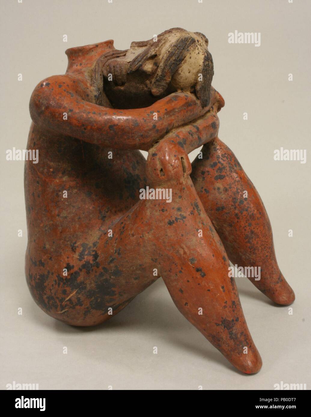 "Mourning" Figure Vessel. Culture: Nayarit. Dimensions: H. 7 5/8 x W. 5 1/2 x D. 6 1/4 in. (19.3 x 14 x 15.9 cm). Date: 2nd century B.C.-A.D. 2nd century. Museum: Metropolitan Museum of Art, New York, USA. Stock Photo