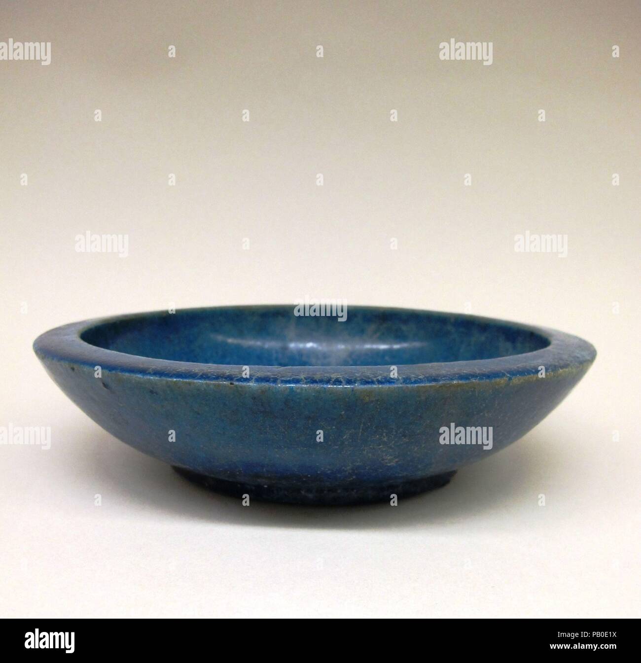 Faience bowl. Culture: Ptolemaic. Dimensions: Diam.: 8 11/16 in. (22 cm). Date: 332-30 B.C..  This bowl, preserved intact, is a fine example of Egyptian faience ware. The Egyptians mastered the production of this luxury ware as early as the late Predynastic period (late fourth millennium B.C.). Faience continued to be used for both sacred and secular objects into Hellenistic and Roman times. Museum: Metropolitan Museum of Art, New York, USA. Stock Photo