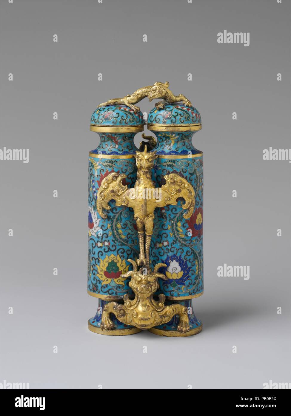 Champion Vase. Culture: China. Dimensions: H. 8 1/2 in. (21.6 cm); W. 3 7/8 in. (9.8 cm); D. 3 1/4 in. (8.3 cm). Date: 18th century.  The term 'champion vase,' which appears only in Western writings, refers to vessels that have two narrow vertical compartments connected by a carving of a mythical bird. It may be a loose translation of yingxiong bei, or hero's cup, referring to the bird (ying) and the bear (xiong) upon which it stands. Champion vases were popular during the middle and late eighteenth century, and were manufactured in different media, including jade, cloisonné enamel, and rhinoc Stock Photo