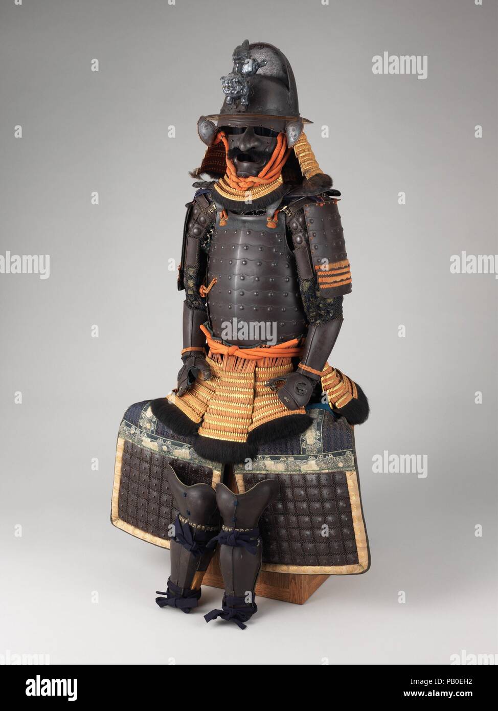 Armor (Gusoku). Culture: Japanese. Dimensions: as mounted: H. 57 3/4 in. (146.7 cm); W. 31 in. (78.7 cm); D. 21 1/2 in. (54.6 cm). Date: 18th century.  This cuirass and shoulder guards (<i>sode</i>) formed of large iron plates rather than traditional lamellae (small, narror iron plates) reveal European influence and the concurrent introduction of firearms, which necessitated solid, bulletproof plates. Museum: Metropolitan Museum of Art, New York, USA. Stock Photo