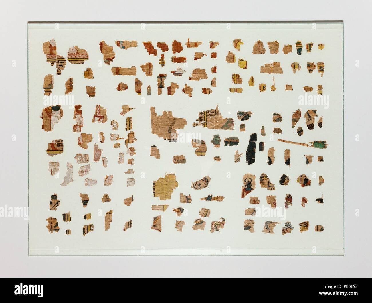 Fragments from a Book of the Dead. Dimensions: mounted in 4 frames, each 28.2 x 38 cm (11 1/8 x 14 15/16 in.). Dynasty: Dynasty 18, possibly later. Reign: Amenhotep III?. Date: ca. 1390-1353 B.C.?.  Fragments of a papyrus mounted in four frames, with additional fragments in two dishes, discovered in Tomb MMA 831 (TT 297). This tomb belonged to an 18th Dynasty official named Amenemotep (also called Djehutynefer) and thus the papyrus may date to this era, specifically to the reign of Amenhotep III; however, a Ramesside date for the papyrus has also been suggested. The text is in vertical columns Stock Photo