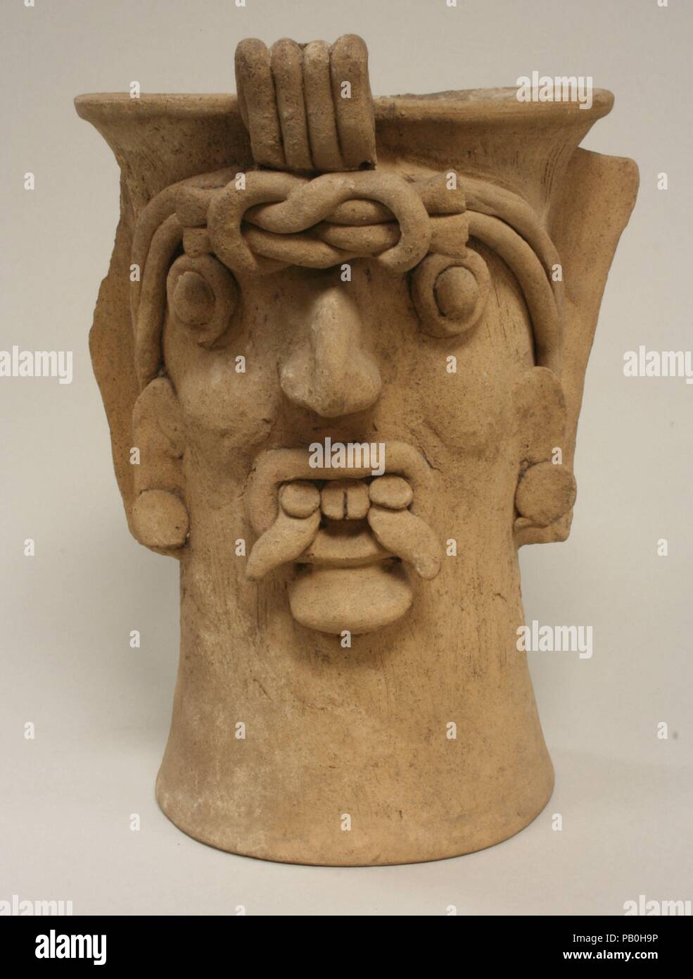Ceramic Head Vessel. Culture: Toltec (?). Dimensions: H. 12 1/16 x W. 9 1/8 x D. 9 5/8 in. (30.7 x 23.2 x 24.5 cm). Date: 10th-13th century. Museum: Metropolitan Museum of Art, New York, USA. Stock Photo