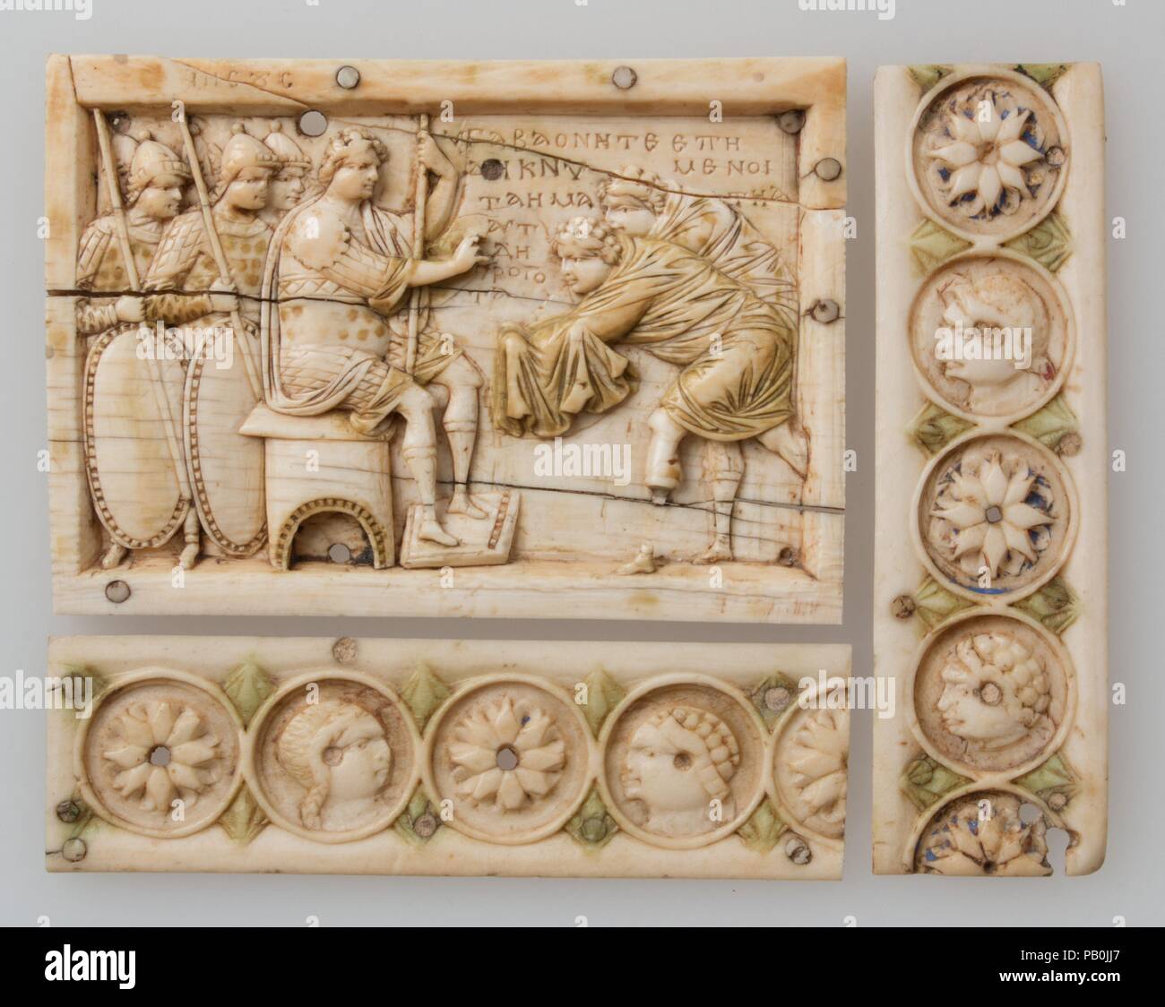 Plaque with Scenes from the Story of Joshua. Culture: Byzantine. Dimensions: a: 2 1/2 x 3 9/16 x 1/4 in. (6.3 x 9 x 0.6 cm)  b: 1 1/16 x 3 9/16 x 1/16 in. (2.7 x 9.1 x 0.2 cm)  c: 3 5/8 x 1 x 1/16 in. (9.2 x 2.6 x 0.2 cm). Date: 900-1000.  These panels are from a casket that illustrated Joshua's conquest of the Promised Land and carry paraphrasings of texts from the Book of Joshua. The first narrative panel, designed to fit a lock plate, shows the capture of the city of Ai and is inscribed, 'And Joshua stretched out his hand toward the city and they rose up quickly and they slew all' (Joshua 8 Stock Photo