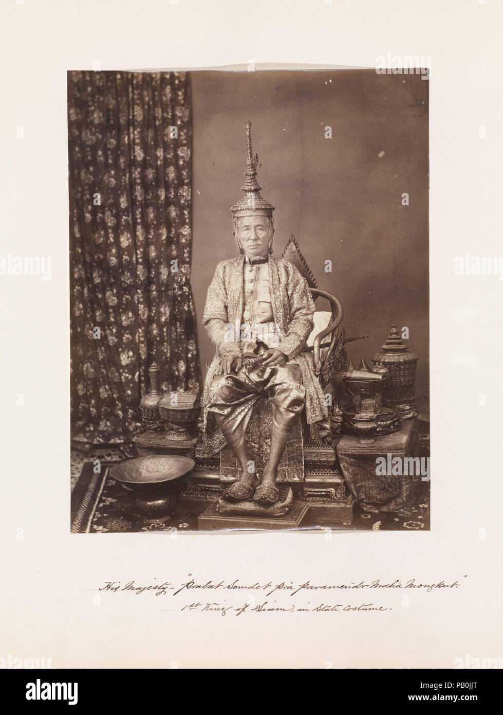 His Majesty Prabat Somdet Pra parameñdr Mahá Mongkut, First King of Siam, in State Costume. Artist: John Thomson (British, Edinburgh, Scotland 1837-1921 London). Dimensions: 22 x 17.2 cm (8 11/16 x 6 3/4 in.). Date: 1865.  John Thomson, a Scotsman who settled in Singapore in 1863, was only beginning his ten-year career as one of the greatest travel photographers of the Far East when he arrived in Bangkok in 1865. Received at the court of King Mongkut, who ruled Thailand as Rama IV from 1851 to 1868, Thomson spent several months in the country, making an excursion to the ruins of Angkor, which  Stock Photo
