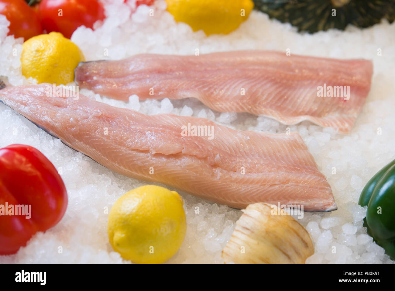 Fresh salmon fillet on ice with fruit Stock Photo - Alamy