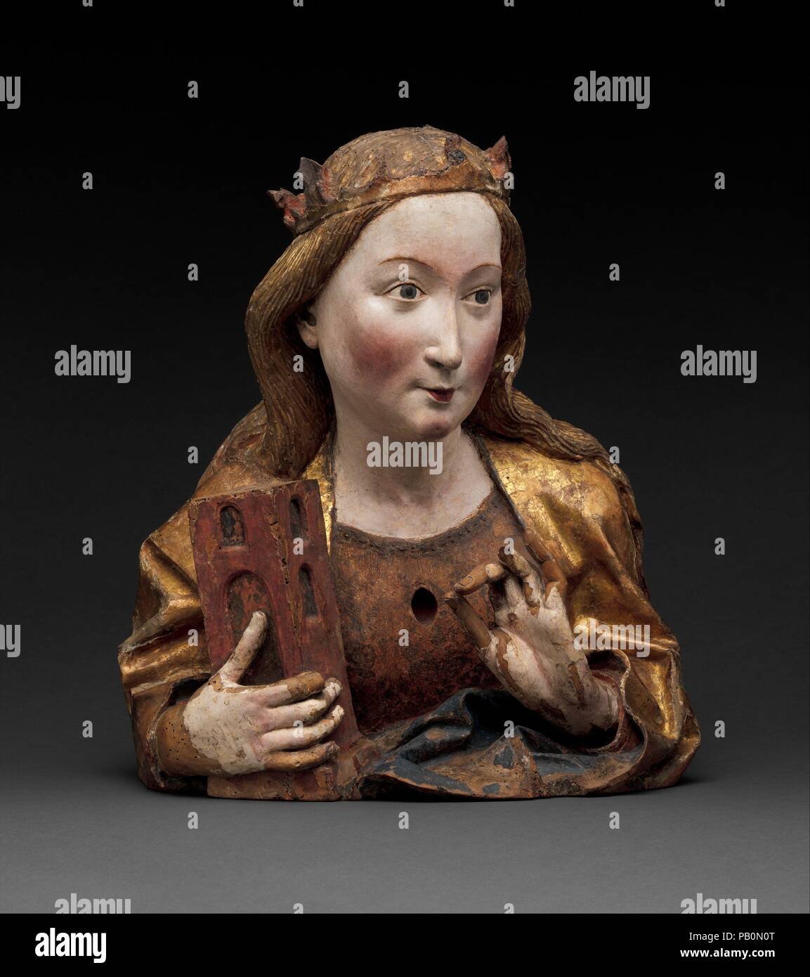 Reliquary Bust of Saint Barbara. Artist: Workshop of Niclaus Gerhaert von Leyden (North Netherlandish, active Strasbourg, ca. 1462-died 1473 Vienna). Culture: German. Dimensions: Overall: 19 7/8 x 17 1/2 x 10 7/8 in. (50.5 x 44.5 x 27.6 cm). Date: ca. 1465.  This bust, and its companion (acc. no. 17.190.1734), reflect the liveliness and innovative naturalistm of sculpture carved in Nikolaus Gerhaert's workshop when he was working in the Upper Rhine region.  Saint Catherine, whose relics were once located in the chest cavity, can be identified by her attributes the sword and the wheel.  The bus Stock Photo