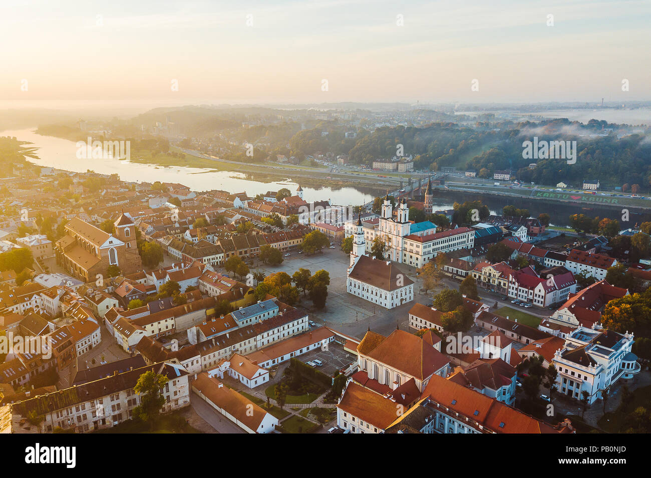 Autumm fog over Kaunas old town, Lithuania. Sunrise moment. Drone aerial view Stock Photo