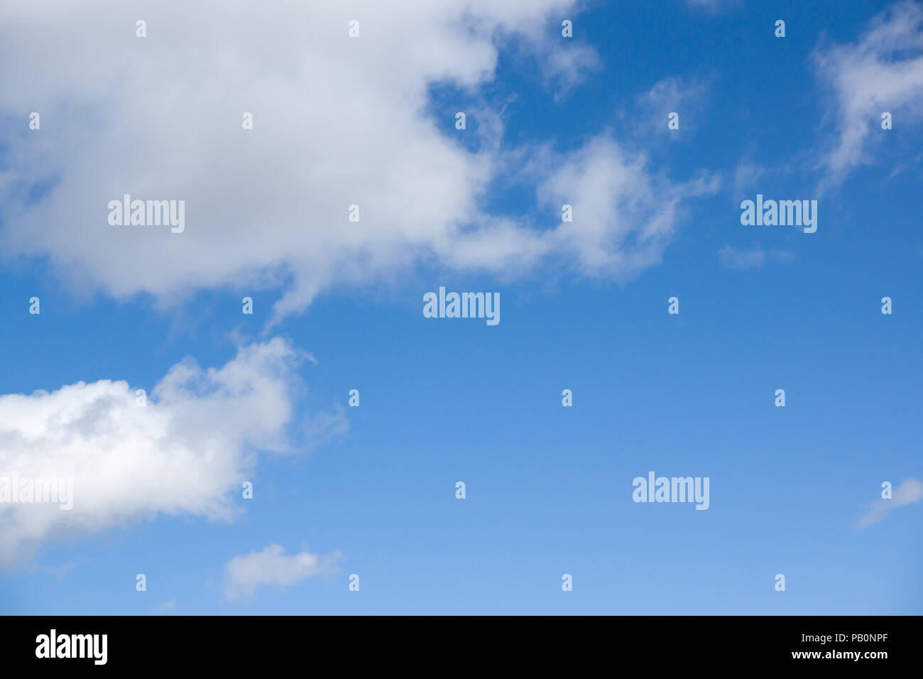 Blue sky with lots of white clouds Stock Photo - Alamy