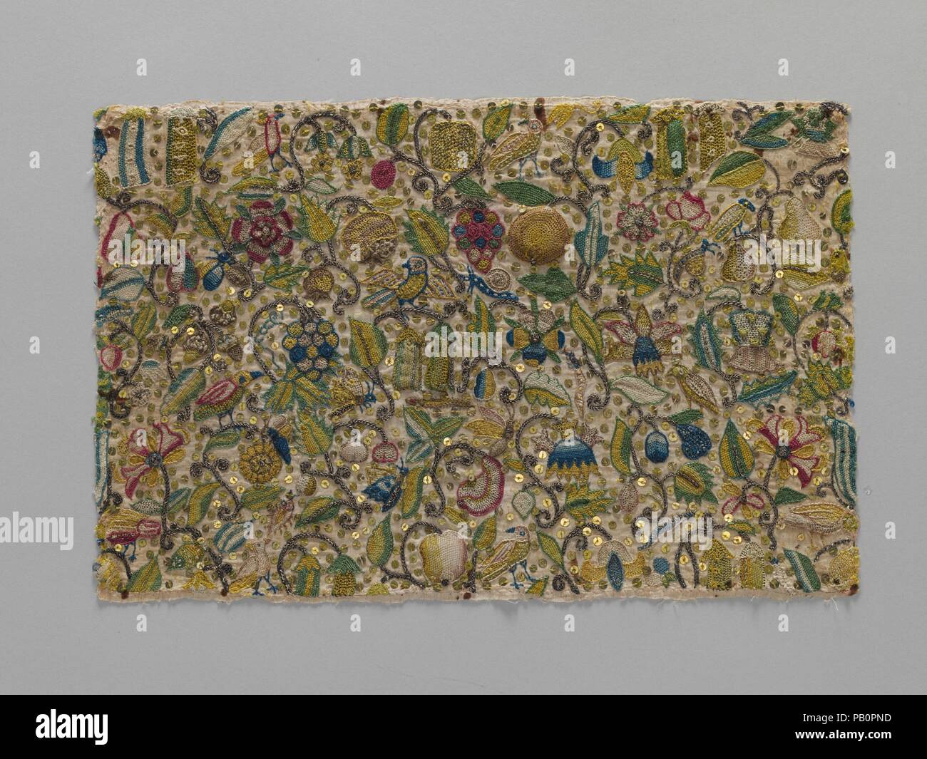Cushion cover. Culture: British. Dimensions: H. 8 7/8 x W. 13 3/8 inches (22.5 x 34 cm). Date: 1590-1610.  This small panel was probably intended to decorate a small cushion or pillow; these were used in large numbers in interior decoration of the sixteenth and seventeenth centuries. Larger versions would have softened hard wooden seats; smaller examples were used as decoration on sideboards and dressing tables. Some were used as pincushions, as great quantities of pins were used to fasten clothing before the advent of zippers and Velcro. Museum: Metropolitan Museum of Art, New York, USA. Stock Photo