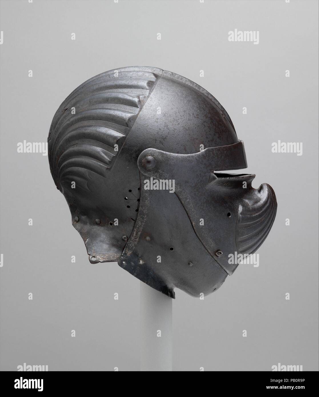 Close Helmet. Armorer: Gian Giacomo Negroli (Italian, Milan 1463-1543). Culture: Italian, Milan. Dimensions: H. 13 1/8 in. (33.3 cm); W. 8 1/2 in. (21.6 cm); D. 12 in. (30.5 cm); Wt. 3 lb. 6 oz. (1530 g). Date: ca. 1510-20.  As the only known work that may be ascribed with reasonable certainty to Gian Giacomo Negroli (1463-1543), this previously unrecorded helmet is a major addition to the small corpus of works marked or signed by members of the celebrated Negroli family of fifteenth- and sixteenth-century Milanese armorers--no more than twenty pieces in total--of which key examples are in the Stock Photo