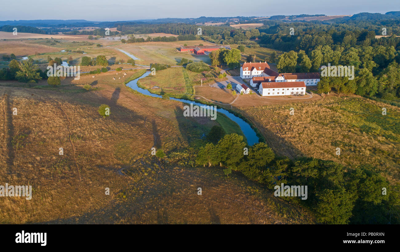 Aerial image of the beautiful valley at Vejle Å and the historic Haraldskær Manor in Denmark. Stock Photo