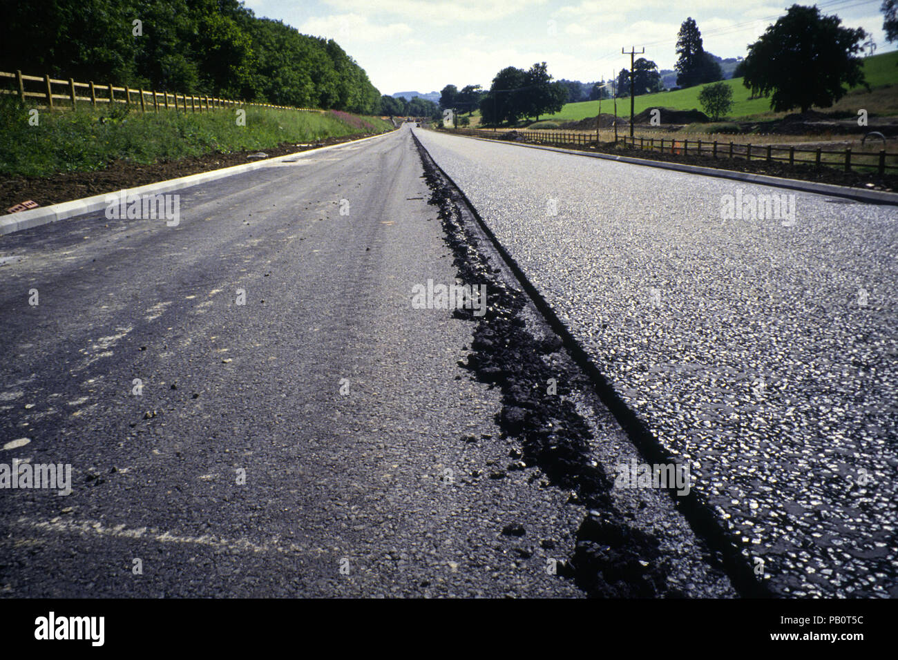 July 1994: A new road under construction being surfaced with tarmac Stock Photo