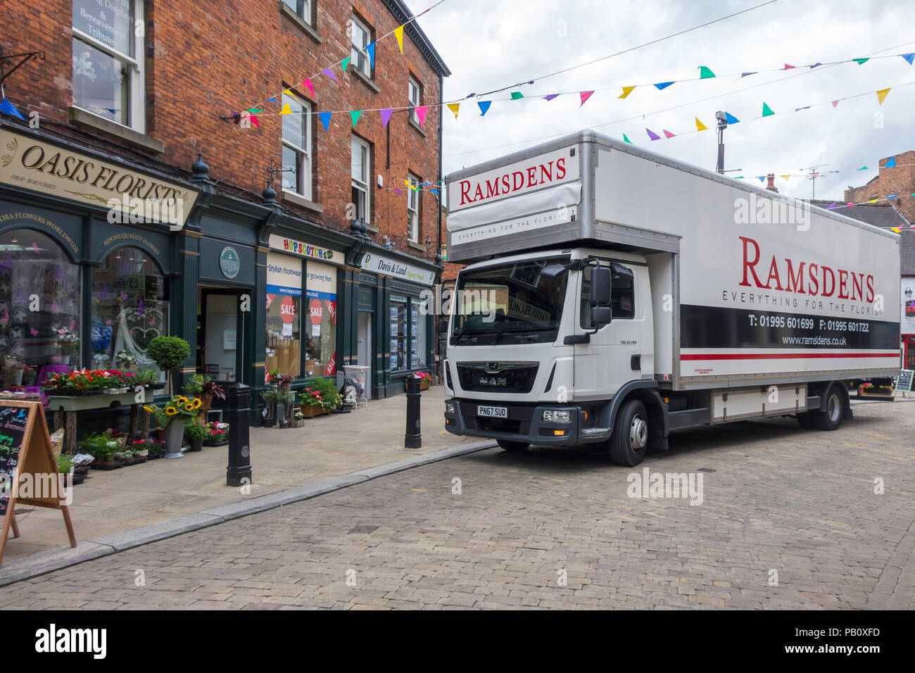 A delivery truck from Ramsdens a specialist supplier for florists, delivering to Oasis Florists in Kirkgate Ripon Yorkshire Stock Photo