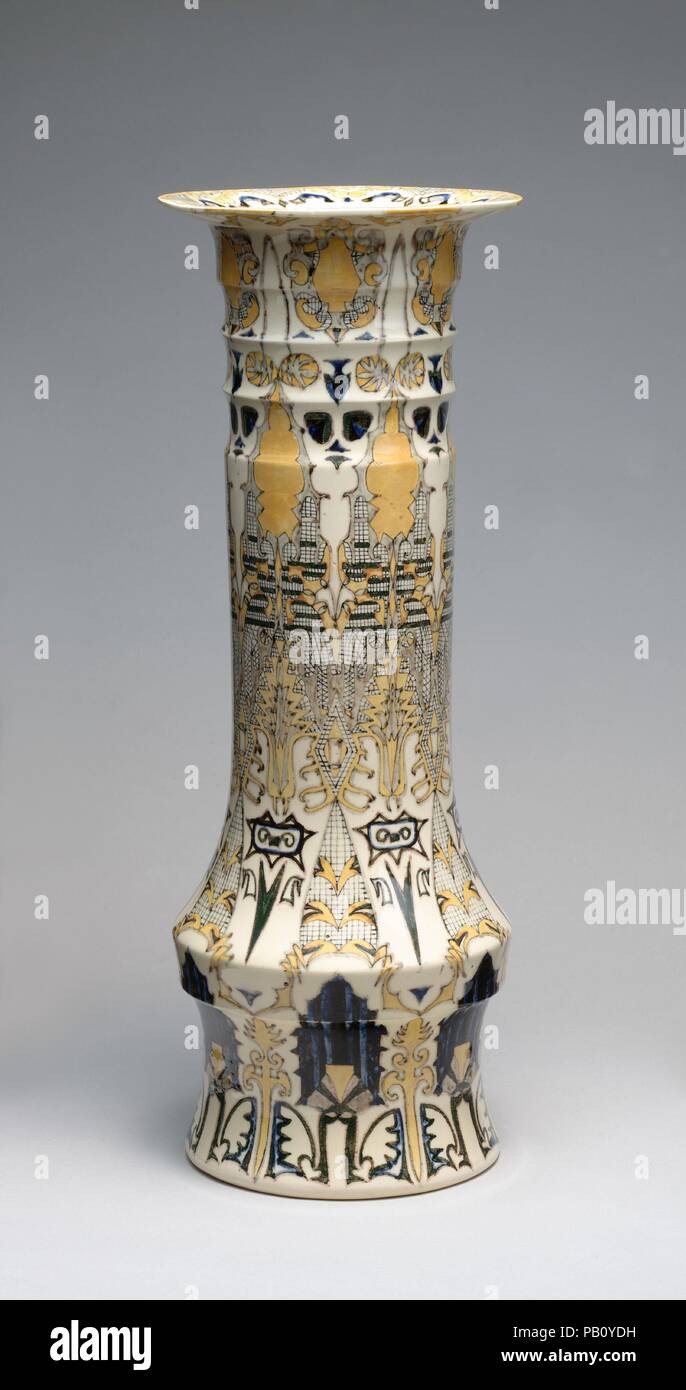 Vase. Culture: Dutch. Designer: T.A.C. Colenbrander (Dutch, Doesburg 1841-1930 Lagg-Keppel). Dimensions: Height: 16 5/8; Width at rim: 6 1/16; Width at shoulder: 5 7/8 in. (42.2 x 15.4 x 14.9 cm). Manufacturer: Rozenburg Plateelfabriek. Date: 1888.  A.C. Colenbrander, the first artistic director of the Rozenburg factory, designed both the form and decoration of this vase.  Colenbrander's designs for ceramics departedcompletely with traditional forms and types of decoration. While he remained at Rozenburg for only four years, his innovative work brought the factory great acclaim. Museum: Metrop Stock Photo