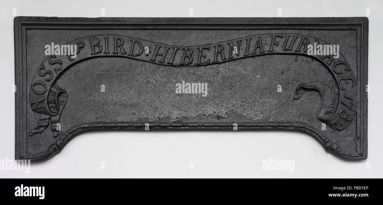 Stove Plate. Culture: American. Dimensions: 12 x 29 3/4 in. (30.5 x 75.6 cm). Maker: Cast by Hibernia Furnace , Morris County, New Jersey. Date: 1782.  Firebacks and single plates from stoves are about all that survive to remind us of the great iron foundries of New Jersey and eastern Pennsylvania that were part of the largest industry in colonial America. The ornamental plates, though of the basest of metals, were cast from mahogany patterns, the handiwork of the best furniture carvers. Early examples were decorated with biblical quotations and static arrangements of hearts and tulips that fo Stock Photo