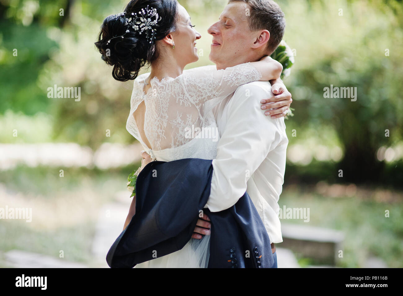 Beautiful wedding couple dancing outdoors in the park Stock Photo - Alamy