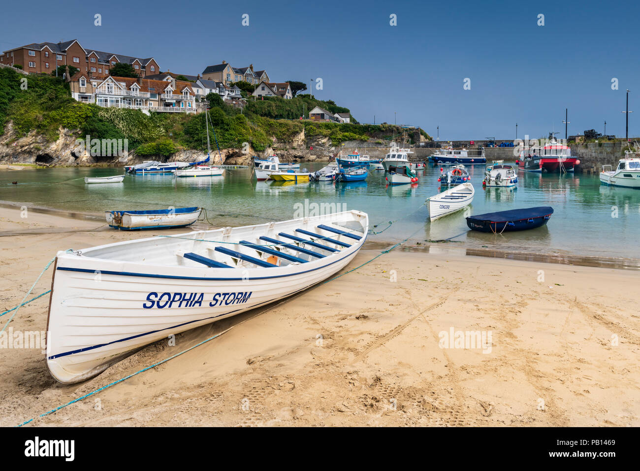 The heatwave continues and the popular holiday resort of Newquay in North Cornwall  is bathed in sunshine as the little fishing boats and pleasure cra Stock Photo