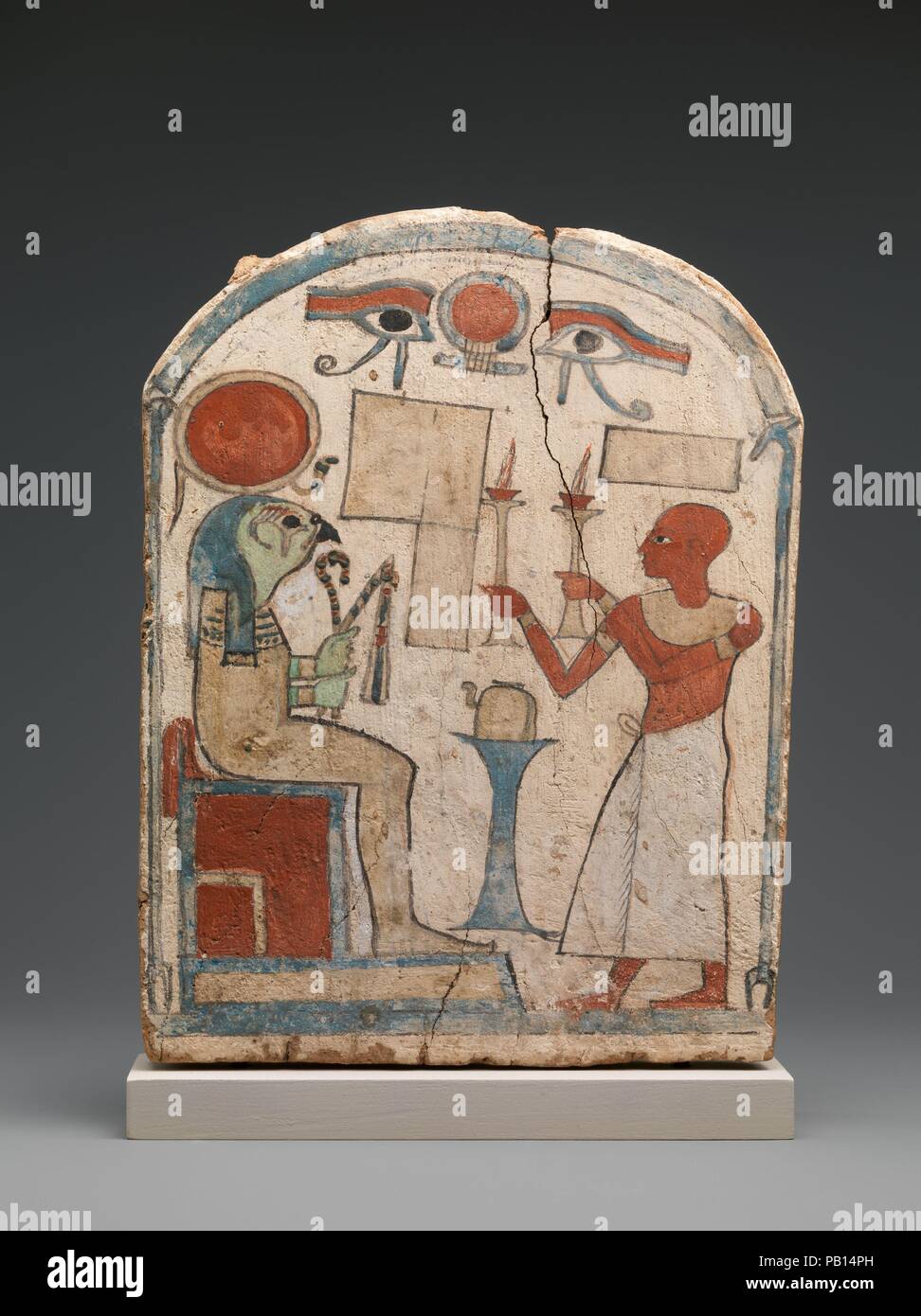 Stela with man offering to Re-Horakhty, unfinished. Dimensions: L. 17.8 × W. 2.2 × H. 22.9 cm (7 × 7/8 × 9 in.). Dynasty: Dynasty 25. Date: ca. 712-663 B.C..  Dating to the Kushite era, when Egypt was controlled by kings from south of Egypt, this round-topped stela depicts a male figure offering braziers of burning incense to the sun god Re-Harakhty. The head of the supplicant is shaved, perhaps indicating that he is a priest, and he wears a broad festival collar, arm and wrist bands, and a long kilt. On his feet are simple sandals. The god, whom he faces across an offering stand bearing a rit Stock Photo