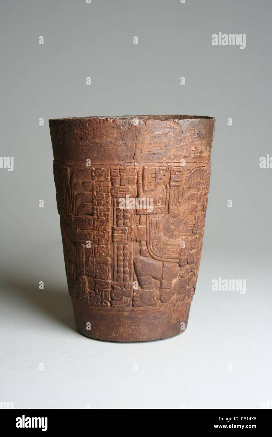 Beaker (kero). Culture: Wari. Dimensions: H. 4 1/2 x Diam. 2 1/2 in. (11.4 x 6.4 cm). Date: 7th-10th century.  Cylindrical beakers with flaring sides, called keros, are a vessel form popular when the cities of Wari and Tiwanaku dominated the central and southern Andes. Used for the consumption of chicha (corn beer) during ceremonies and everyday gatherings, they played an important role in the maintenance of social and political relations. Keros were made of wood, fired clay, gold, and silver--the material reflecting the social status of the owner. They are decorated on the exterior with relig Stock Photo