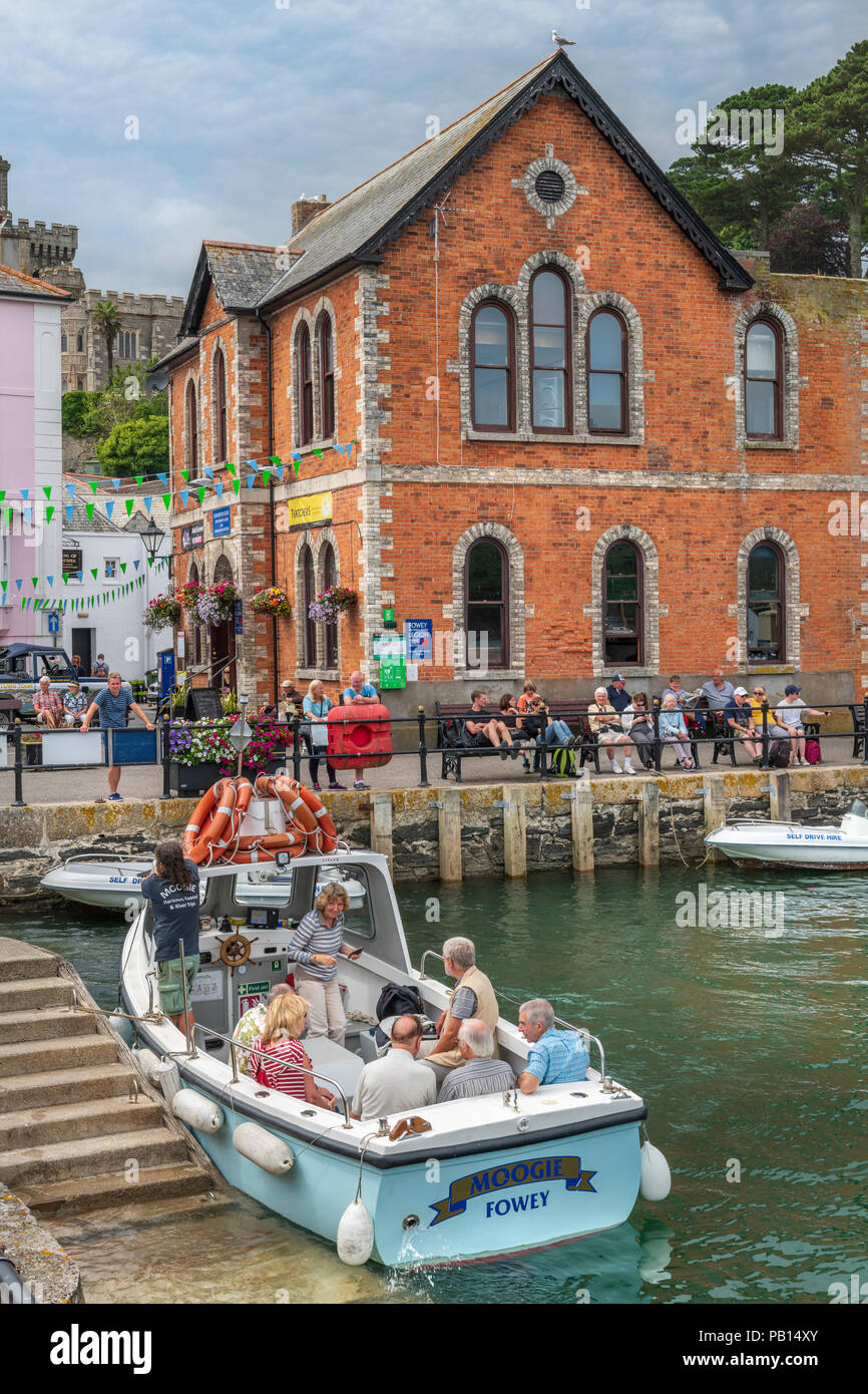 Boat Trips around the picturesque little harbour at Fowey in East Cornwall proving a very popular tourist attraction on a hot summer's day in July. Stock Photo