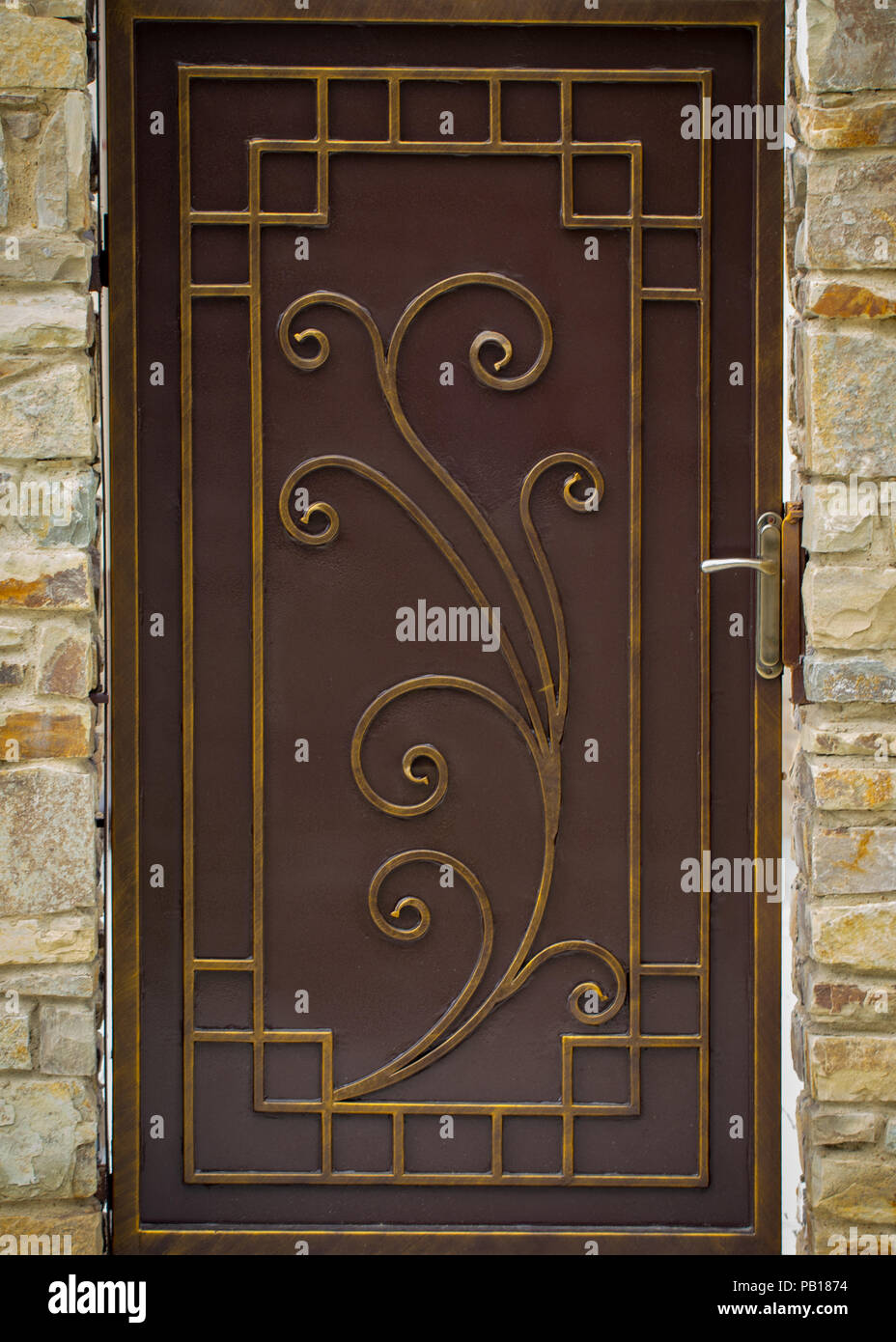 ornate wrought-iron elements of metal gate decoration Stock Photo - Alamy