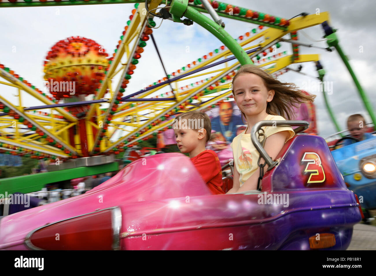 Young Boy and Girl at Fairground, Newcastle,UK Stock Photo