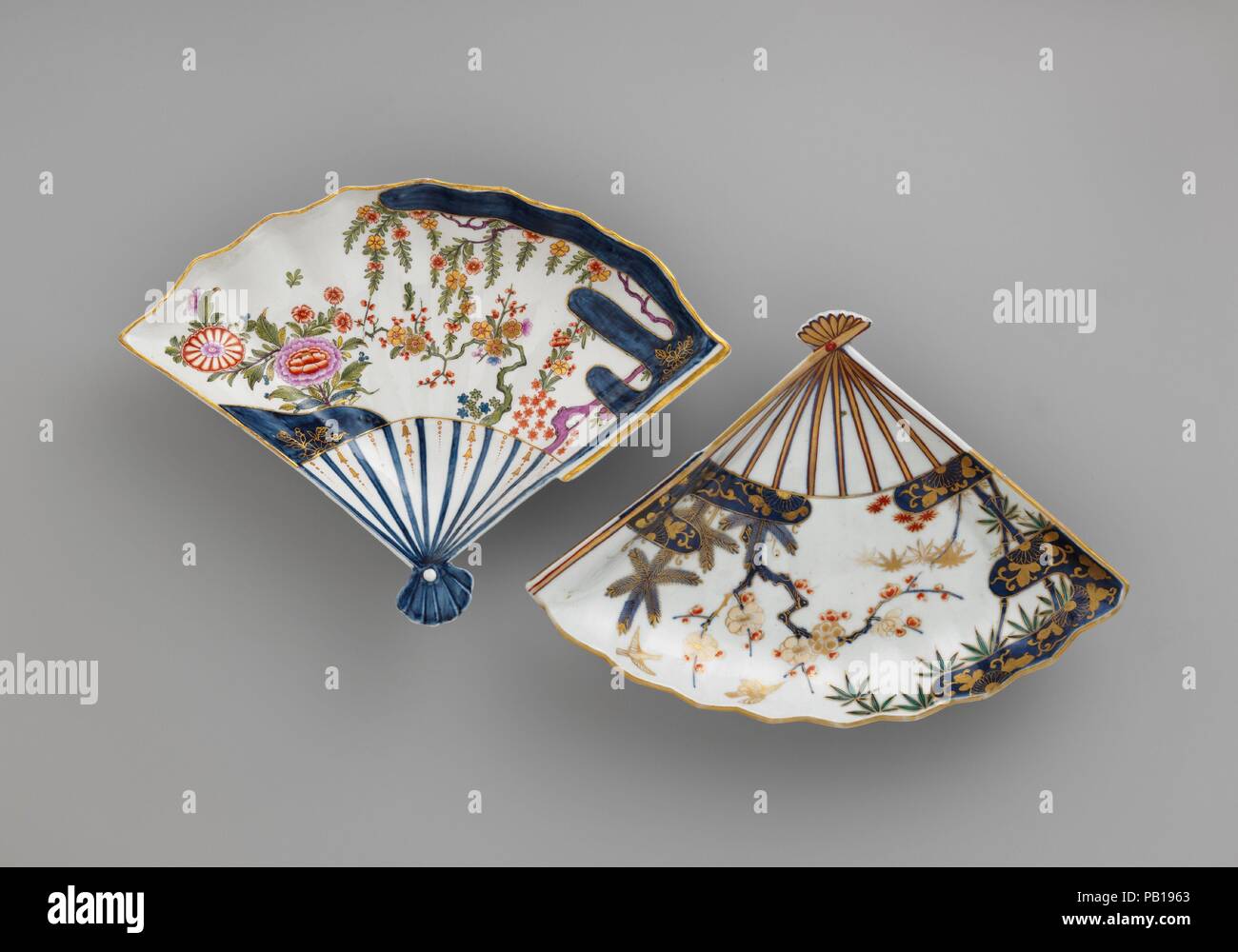 Fan-shaped dish. Culture: Austrian, Vienna. Dimensions: H. 2-3/8 in. (6.0 cm.); L. 11-1/8 in. (28.3 cm.); W. 8-1/8 in. (20.6 cm.). Factory: Vienna. Factory director: Du Paquier period (1718-1744). Date: ca. 1725-30.  This dish and its Japanese prototype show a creative amalgamation of form and decoration from several sources. The shape is a Japanese invention, with precedents in paintings on fans and in fan-shaped paintings pasted on screens. The Three Friends motif of pine, bamboo, and plum has its origins in Chinese literati painting. The Du Paquier factory made the only known copies of this Stock Photo