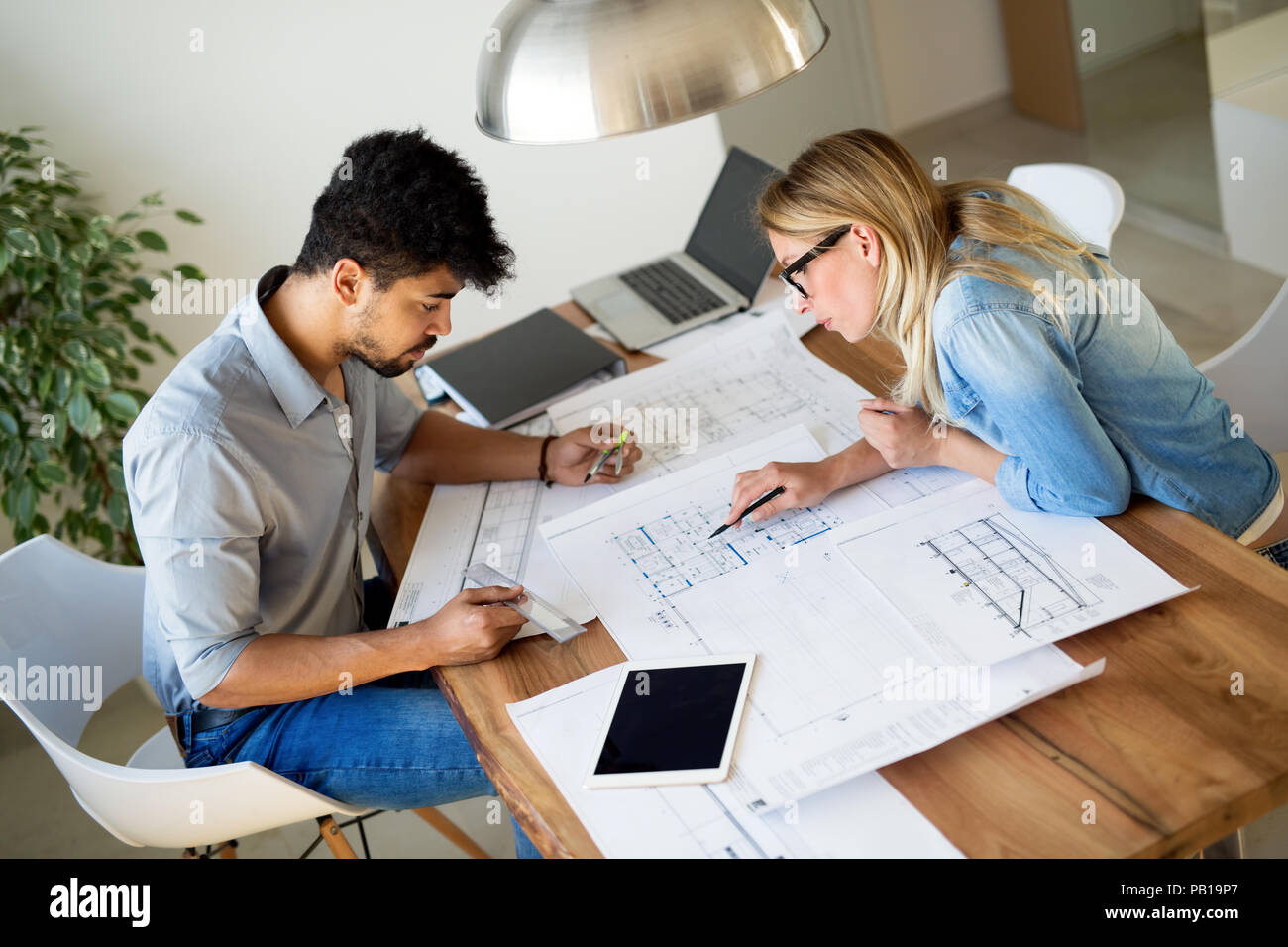 Business People and architects working on project together Stock Photo ...