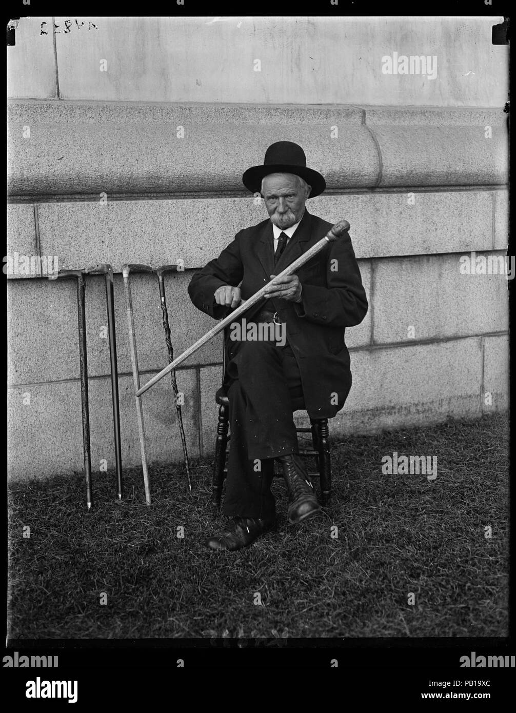 A. Buck of the Soldiers' Home carving the Lord's Prayer on walking