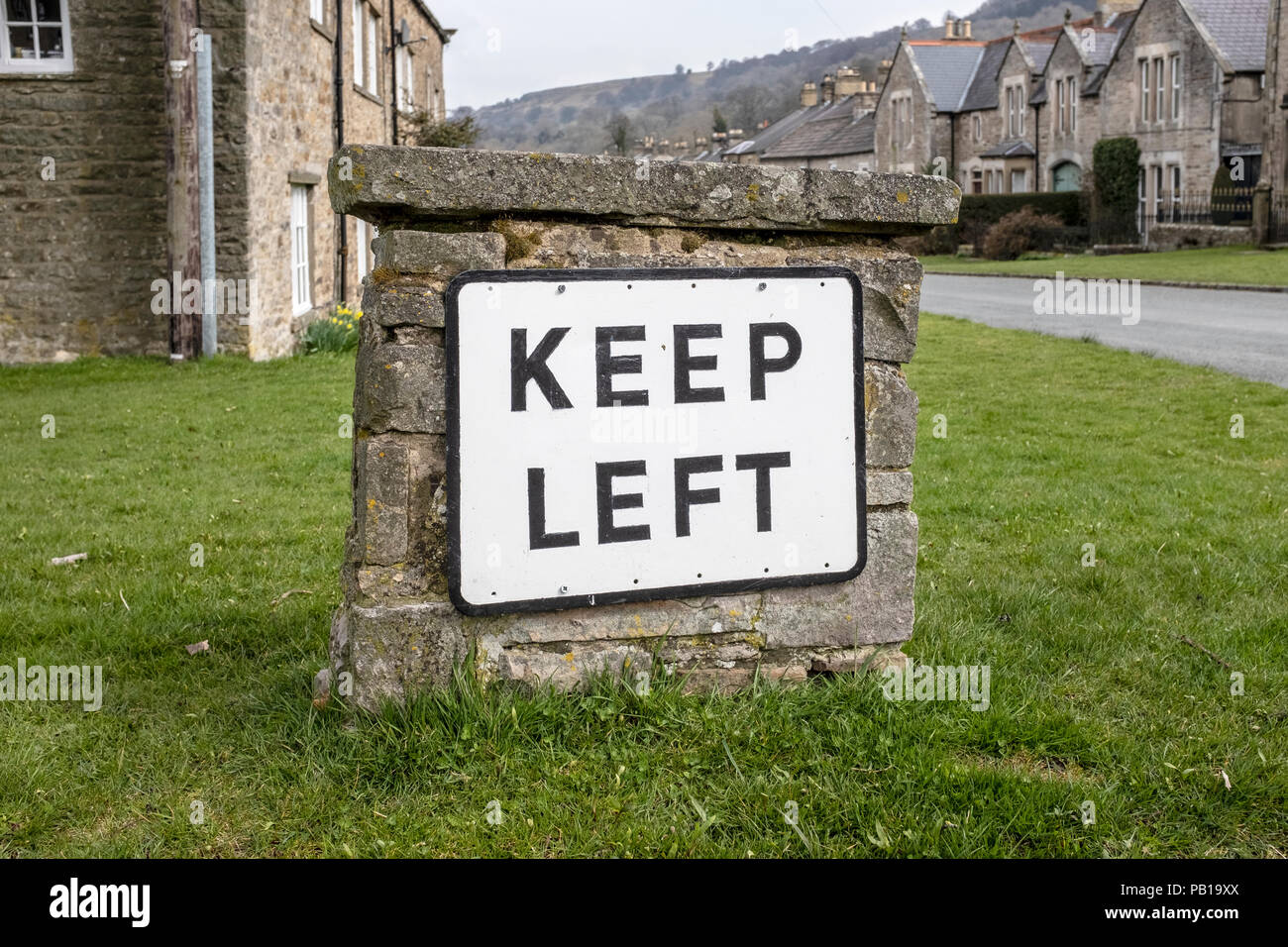 Keep Left sign in West Burton village, Yorkshire Dales, England, United Kingdom. Stock Photo