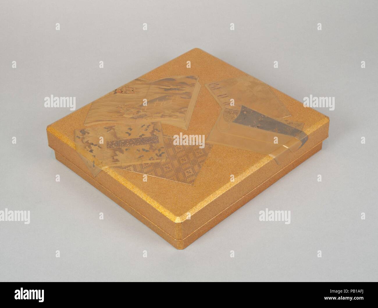 Writing Box with Illustrated Books. Culture: Japan. Dimensions: H. 1 15/16 in. (4.9 cm); W. 9 in. (22.9 cm); D. 9 13/16 in. (24.9 cm). Date: 19th century.  The writing box (suzuri-bako) contains an inkstone and a water dropper, as well as an inner tray for writing implements. The lid is embellished with several illustrated characters that refer to the murmur of the river (see ill.). The frog is also associated with spring. In the kana preface of the Kokin wakashu by Ki no Tsurayuki, there is an often cited sentence: 'The song of the warbler among the blossoms, the voice of the frog dwelling in Stock Photo