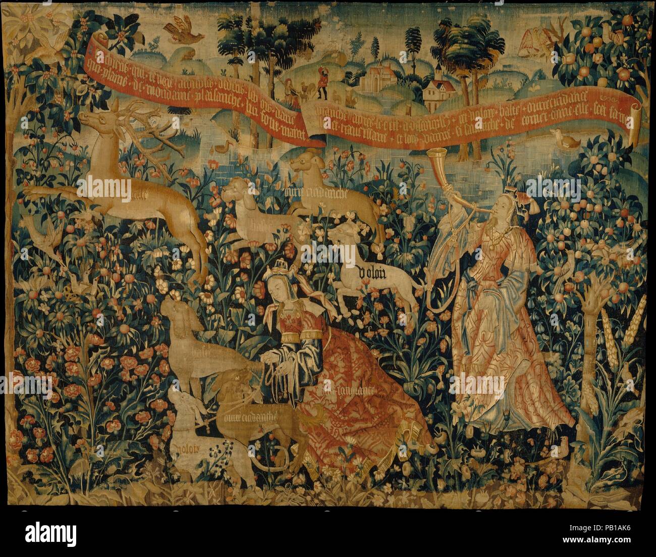 Vanity Sounds the Horn and Ignorance Unleashes the Hounds Overconfidence, Rashness, and Desire (from The Hunt of the Frail Stag). Culture: South Netherlandish. Dimensions: Overall: 118 x 150in. (299.7 x 381cm). Date: ca. 1500-1525.  This tapestry fragment is part of a series that symbolically represents man's life on earth as a stag hunt. Man is depicted here as 'the fragile stag' at the upper left bounding through the woods. The stag is being hunted by Desire, Rashness, and Overconfidence, the hunting dogs set loose by Ignorance, portrayed as an elegantly dressed woman at the bottom center of Stock Photo