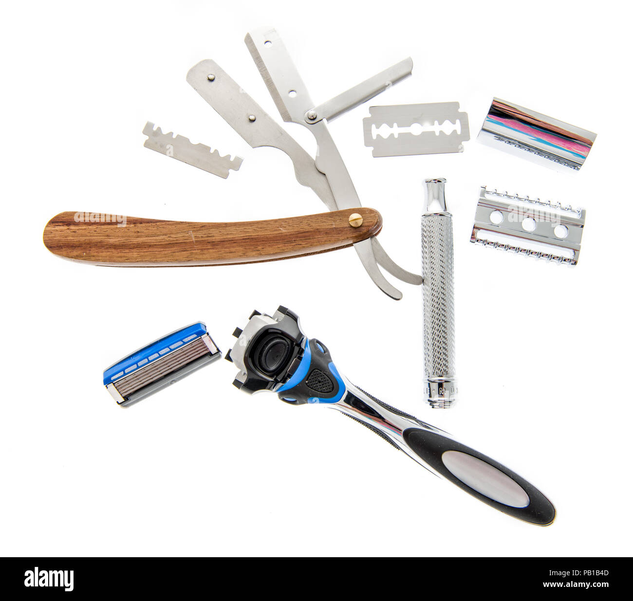 Three different kind of razors including safety, straight and disposable that are disassembled on an isolated background. Stock Photo