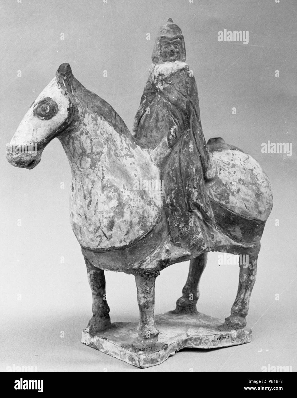 Figure of an Equestrian Soldier. Culture: China. Dimensions: H. 8 1/4 in. (21 cm); L. 7 1/2 in. (19.1 cm). Date: 5th-6th century. Museum: Metropolitan Museum of Art, New York, USA. Stock Photo