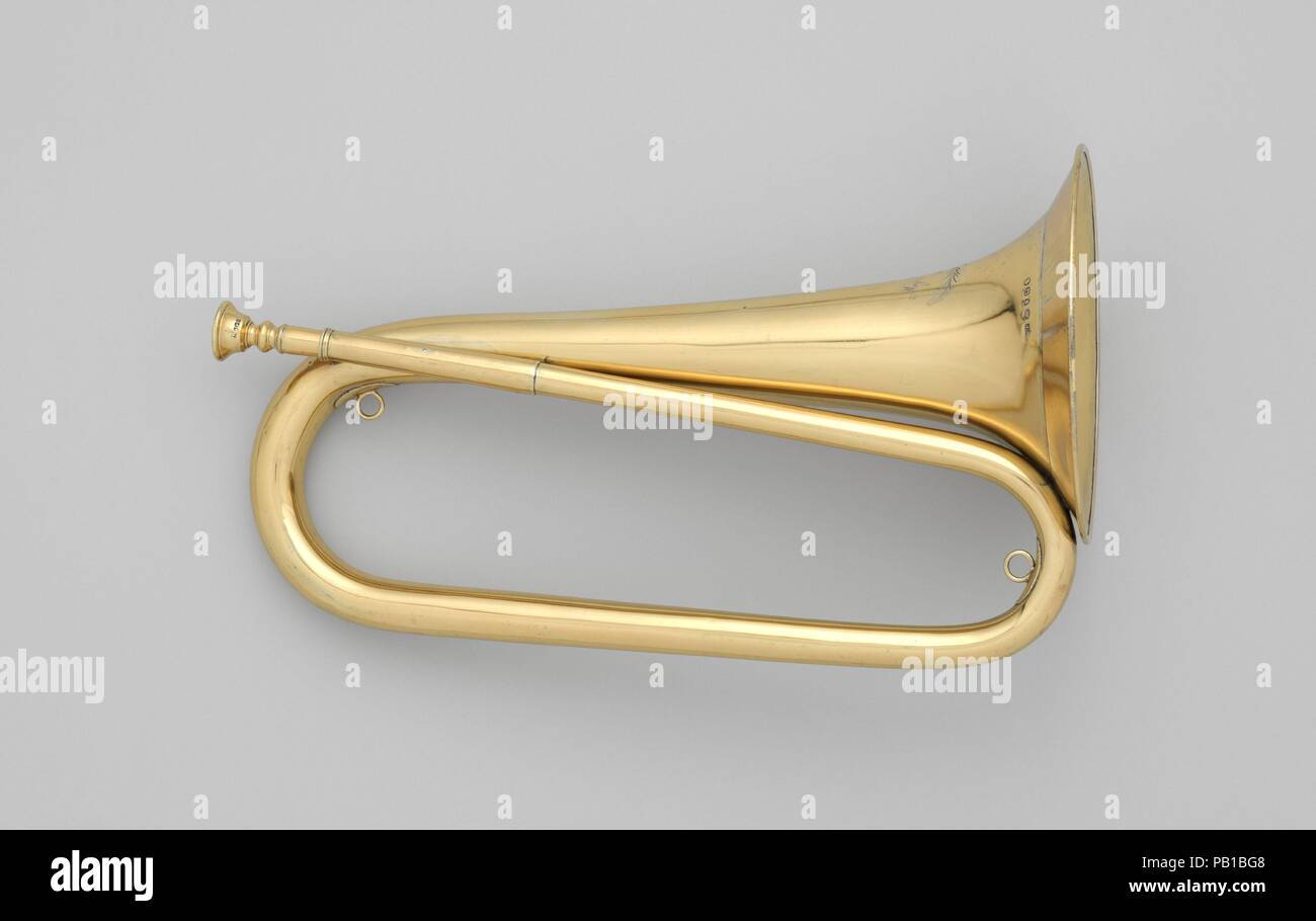 Bugle in C. Culture: British. Dimensions: Height (without mouthpiece): 14 3/4 in. (37.5 cm)  Diameter (Of bell): 6 3/4 in. (17.1 cm). Maker: Thomas Key (British, active London before 1805-1858); William Trayls (silversmith). Date: 1811.  Engravings on the bell indicate that the bugle was made in the year 1811 (represented by the letter Q) by the silversmith William Trayls (initials WT). Other marks represent the sterling standard (lion passant), the London Assay Office (leopard head), and the excise duty mark (sovereign's head). Also engraved on the bell is the name Major Drummond of the 104th Stock Photo