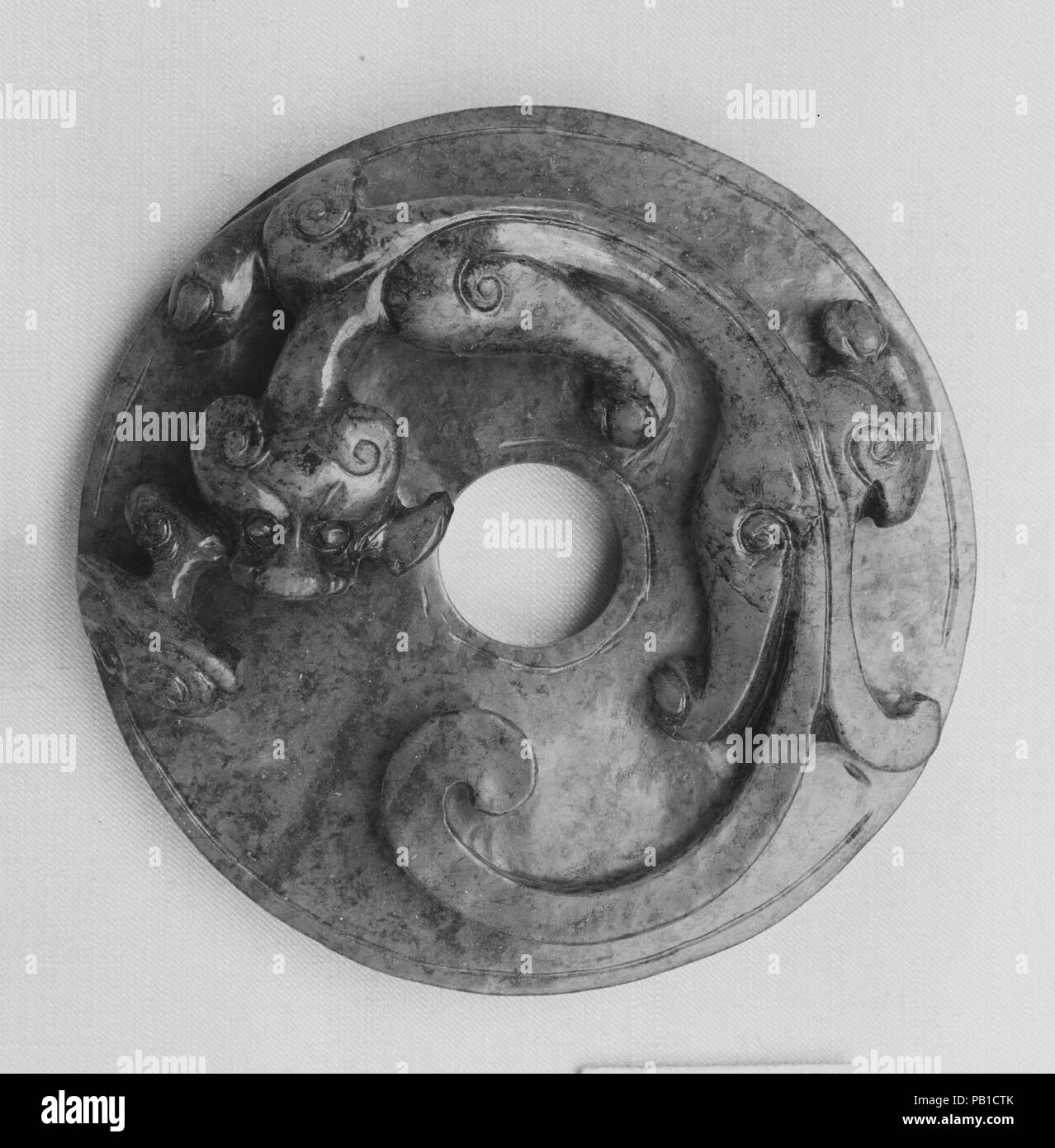Disk. Culture: China. Dimensions: Diam. 2 5/8 in. (6.7 cm); Th. 3/4 in. (1.9 cm). Museum: Metropolitan Museum of Art, New York, USA. Stock Photo
