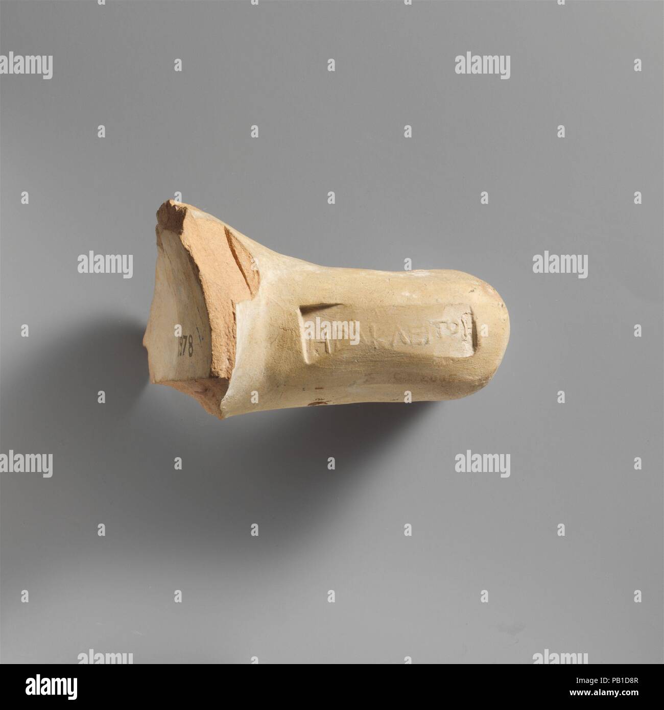 Terracotta amphora handle with stamp. Culture: Greek, Rhodian. Dimensions: Other: 4 in. (10.2 cm). Date: ca. 220-180 B.C..  The stamp bears the name of the potter Herakleitos. Museum: Metropolitan Museum of Art, New York, USA. Stock Photo