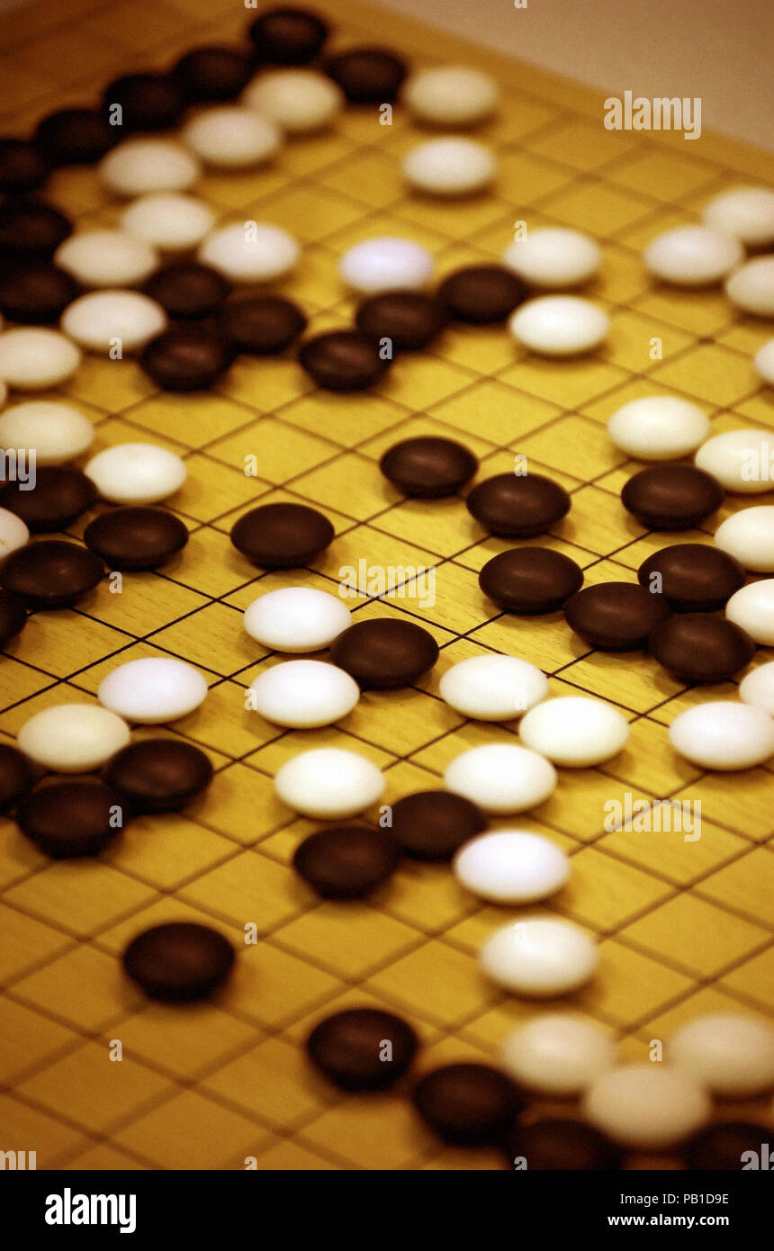 detail of a board with stones for the oriental ancient strategy table