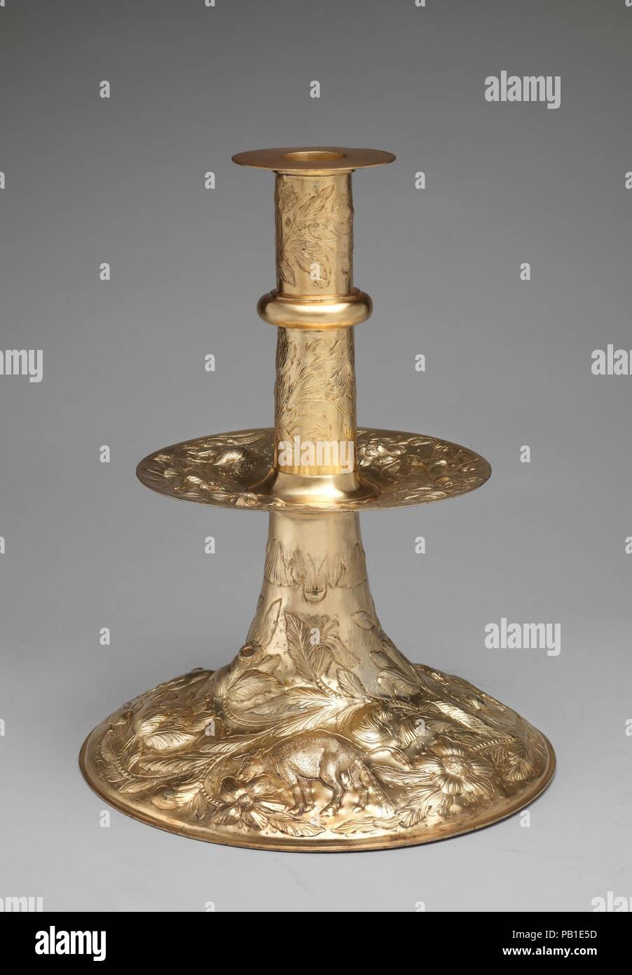 Candlestick. Culture: British, Birmingham, after British, London original. Dimensions: Overall (confirmed): 17 7/8 × 14 3/16 × 14 3/16 in. (45.4 × 36 × 36 cm). Manufacturer: Elkington & Co. (British, Birmingham, 1829-1963). Date: 19th century, after 1663-64 original.  This electrotype is after a seventeenth-century original (1663-64) in the Treasury of the Kremlin, Moscow. It was a gift to Tsar Alexei by the ambassador Charles Howard from King Charles II in 1664. Museum: Metropolitan Museum of Art, New York, USA. Stock Photo