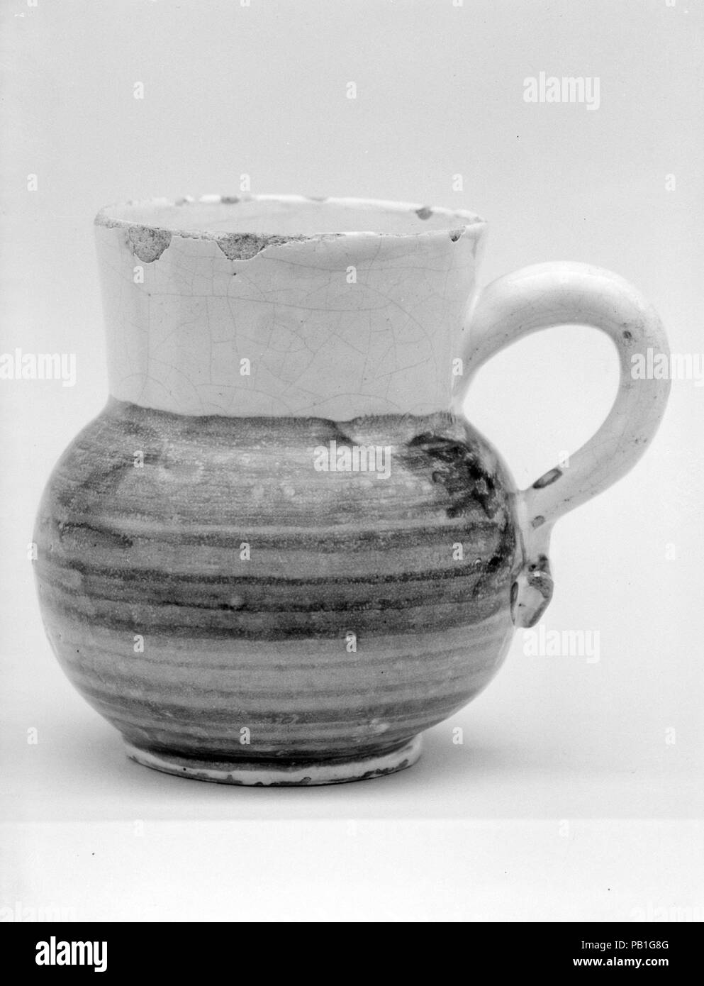 Mug. Culture: British. Dimensions: 3 5/8 x 4 1/8 in. (9.2 x 10.5 cm). Maker: Lambeth Factories. Date: 1680-1700. Museum: Metropolitan Museum of Art, New York, USA. Stock Photo