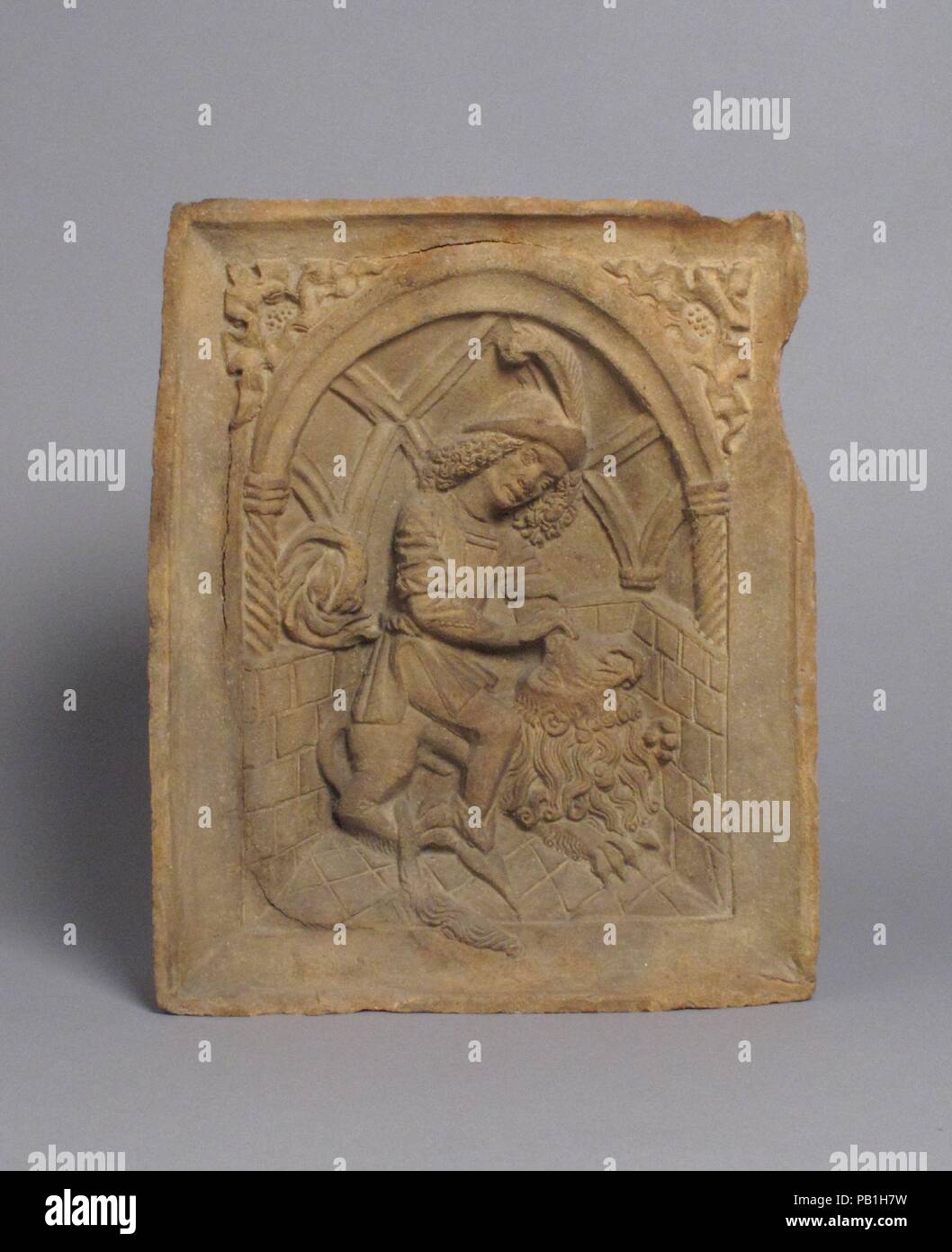 Oven Tile with Samson and the Lion (Based on an Engraving by Master E.S.). Culture: Austrian. Dimensions: Overall: 9 7/8 x 8 1/8 x 2 11/16in. (25.1 x 20.6 x 6.8cm). Date: ca. 1490. Museum: Metropolitan Museum of Art, New York, USA. Stock Photo