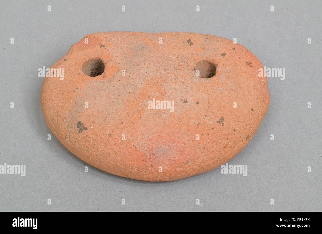 Weighing down device (fish net sinker?). Dimensions: l. 6.5 cm (2 9/16 in). Dynasty: Dynasty 19-20. Date: ca. 1295-1070 B.C.. Museum: Metropolitan Museum of Art, New York, USA. Stock Photo