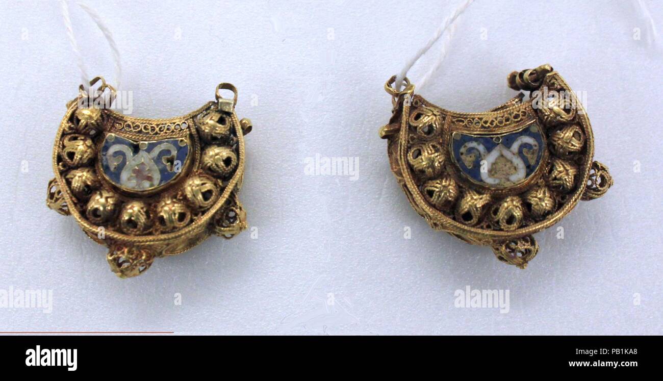 Earrings. Dimensions: H. 1 in. (2.5 cm) W. 1 1/16 in. (2.7 cm) D. 7/16 in.  (1.1 cm) Wt. 0.2 oz. (5.8 g). Date: 11th-12th century. These earrings or  pendants have been