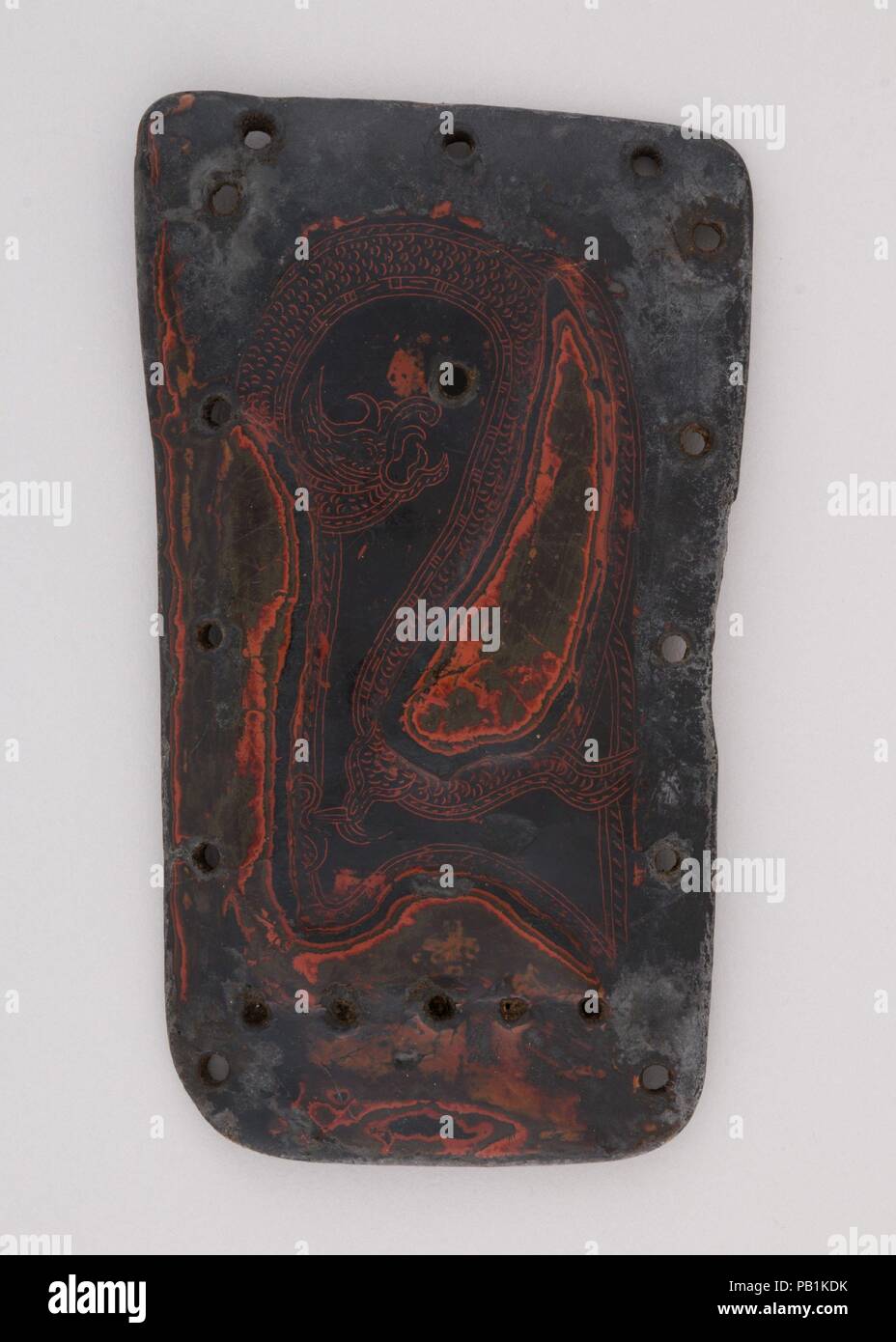 Element from a Lacquered Leather Cuirass. Culture: Yi or Nuosu, China (Yunnan or Sichuan). Dimensions: L. 7 3/4 in. (19.7 cm); W. 4 1/2 in. (11.4 cm). Date: 8th-10th century. Museum: Metropolitan Museum of Art, New York, USA. Stock Photo