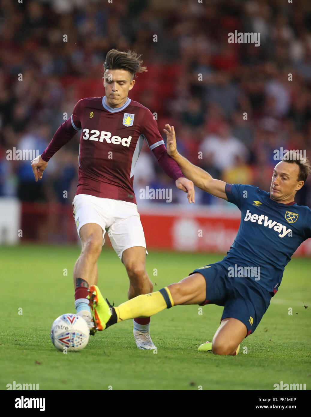 Aston Villa's Jack Grealish and West Ham's Mark Noble during a pre season friendly match at Villa Park, Birmingham. PRESS ASSOCIATION Photo. Picture date: Wednesday July 25, 2018. Photo credit should read: David Davies/PA Wire. No use with unauthorised audio, video, data, fixture lists, club/league logos or 'live' services. Online in-match use limited to 75 images, no video emulation. No use in betting, games or single club/league/player publications. Stock Photo
