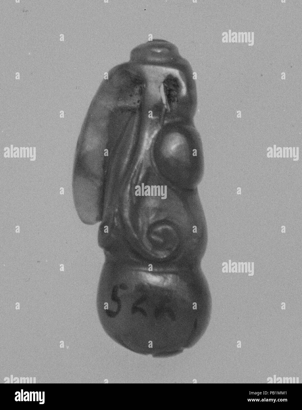 Pendant. Culture: China. Dimensions: H. 13/16 in. (2.1 cm); W. 3/8 in. (0.9 cm); L. 3/16 in. (0.5 cm). Museum: Metropolitan Museum of Art, New York, USA. Stock Photo